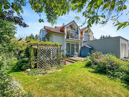 Großzügige Terrassenwohnung mit Wintergarten, Stellplatz und Gartenanteil in ruhiger und grüner Lage