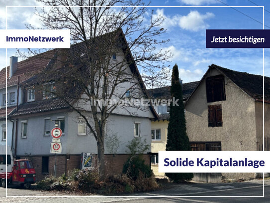 Mittendrin: Wohnhaus mit Renditepotenzial im Stadtteil Unterjesingen. 2 Garagen, 1 Stellplatz