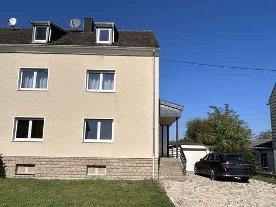 Großzügiges Haus mit Garten und Garage in ruhiger Lage