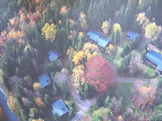 Einzigartiges Feriendorf in absoluter Alleinlage auf Waldgrundstück