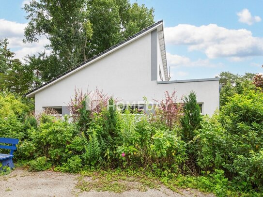 Offenes Wohnen auf einer Ebene: Modernes Architektenhaus mit großem Garten in traumhafter Lage