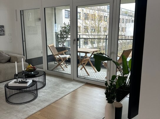 2,5-Zimmer mit Designermöbeln und Balkon + TG im Zentrum – Übernahme der Einrichtung