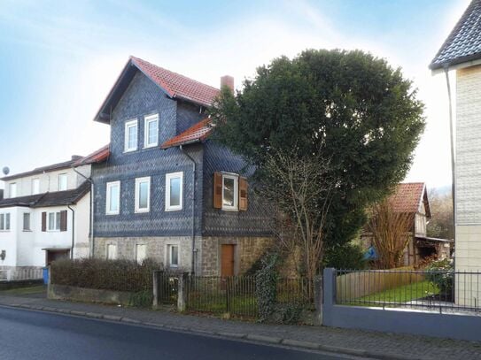 AUMÜLLER-Immobilien - Sympathisches Einfamilienhaus mit Garten und Werkstatt/Atelier im Nebengebäude