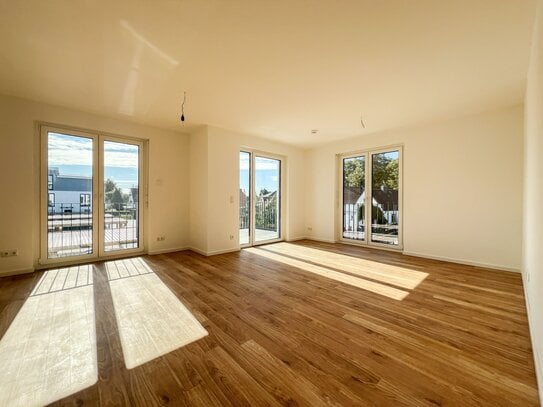 Bezugsfertige 4-Zimmer-Wohnung im 1. Obergeschoss mit Balkon.