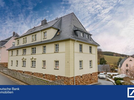 Exklusives Mehrfamilienhaus mit zeitlosem Charme und modernem Wohnkomfort.