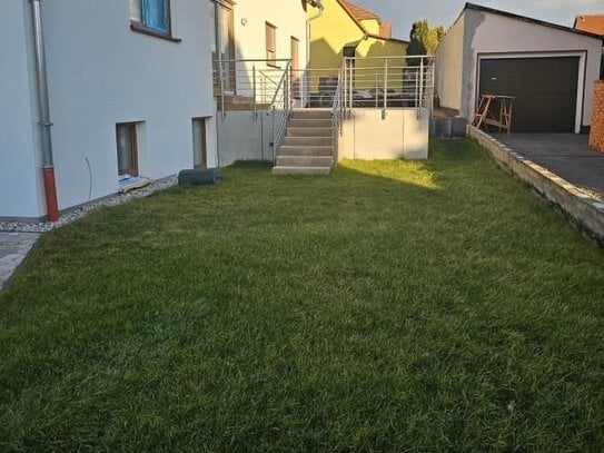 Besondere Familienwohnung über 4 Ebenen mit großer Terrasse und Garten im Erstbezug!