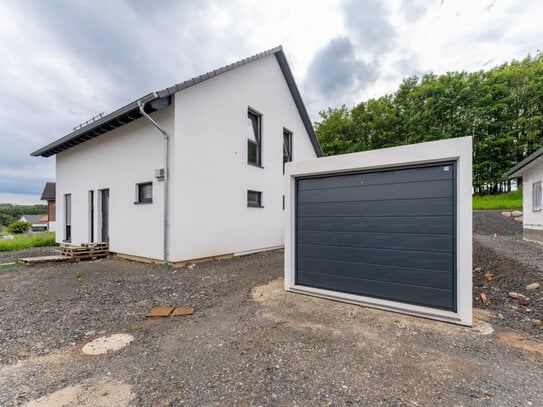 Wohnen, wo andere Urlaub machen: Neubau - freistehendes Einfamilienhaus in idyllischer Wohnlage!