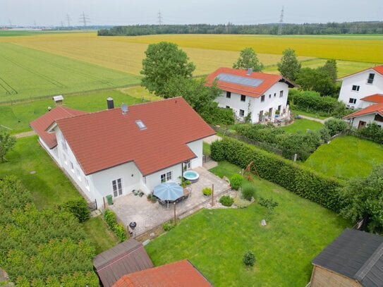 Einfamilienhaus mit Einliegerwohnung: Vielseitiges Wohnen in grüner Oase!