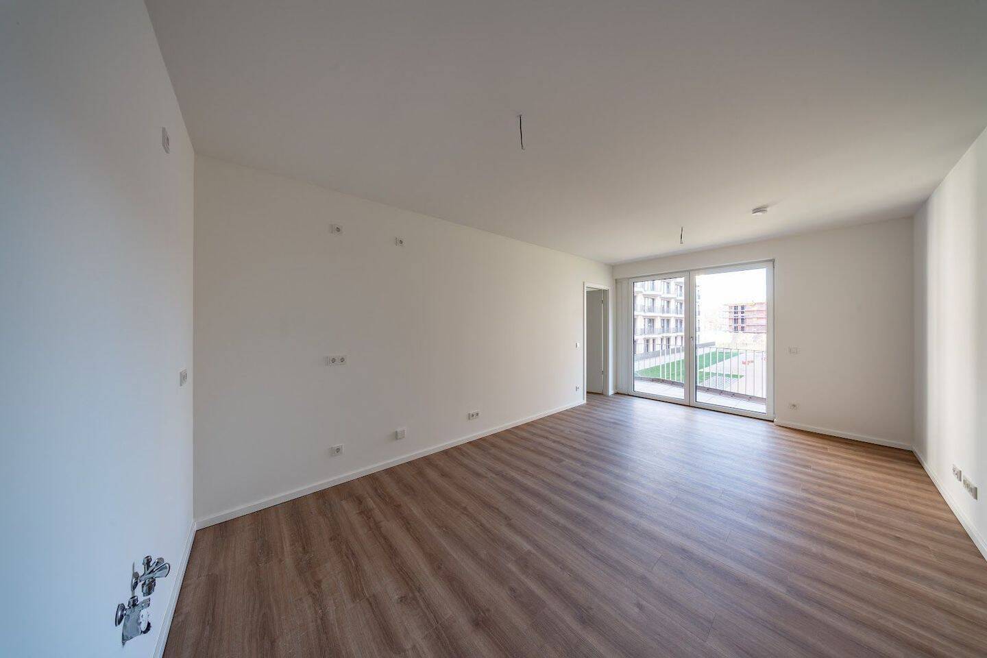 Neubauwohnung im Erstebug mit Fußbodenheizung und Balkon - Foto 1