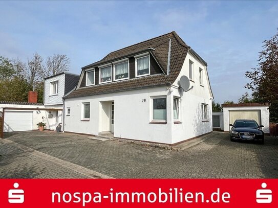 Einfamilienhaus mit zwei Wohneinheiten, zwei Garagen und Terrasse auf der "Insel an Land"