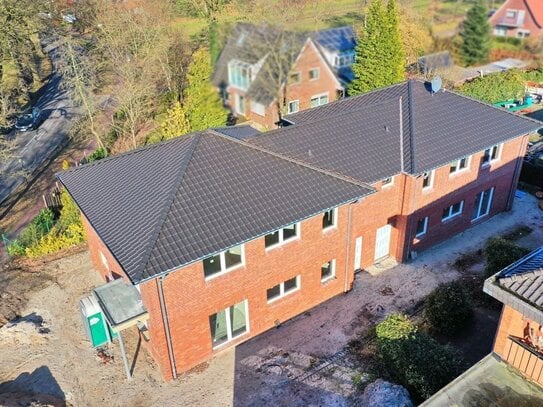 Moderne Oberwohnung mit optimaler Raumaufteilung, einer Einbauküche und Balkon im Herzen von Remels