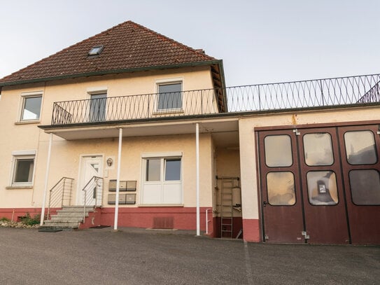 Ihr neues Investment - attraktives Mehrfamilienhaus mit separatem Verkaufsraum