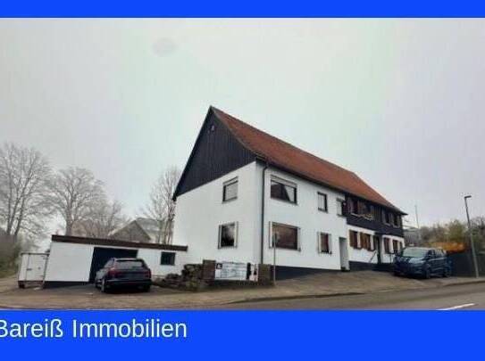 *Ohne Bebauungsplan* Zwei doppelhaushälften mit Gewerbe, Garagen und Garten