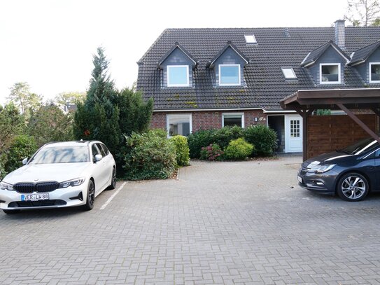 Erdgeschosswohnung mit Terrasse, Gartenanteil und Stellplatz