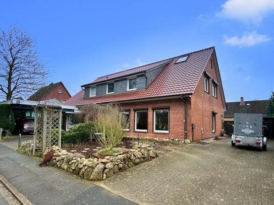 Tolle Wohnung im EG eines Zweifamilienhauses mit Garten und Carport