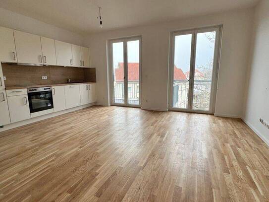Erstbezug: Geräumige 4-Zimmer-Wohnung mit Balkon, hochwertiger EBK und 2 Bädern