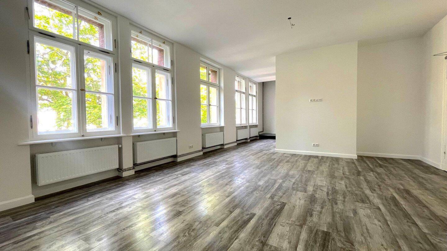 Erstbezug: Maisonette-Wohnung mit Loft-Charakter und großem Garten - Foto 1