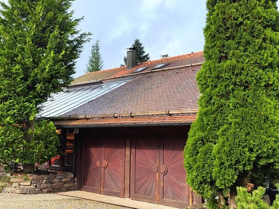 Idyllisches Einfamilienhaus mit großem Wintergarten, Doppelgarage und herrlichem Grundstück!