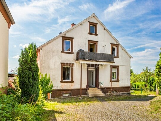 Mehrfamilienhaus mit vier Wohneinheiten, großem Garten und viel Potenzial