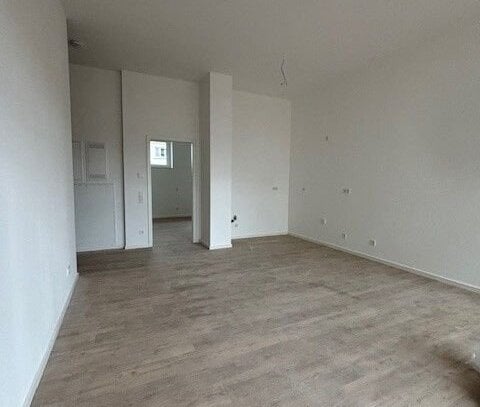 **Erstbezug** Lichtdurchflutete und geräumige 2-Zimmer-Wohnung mit Terrasse und Gartenanteil