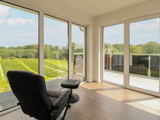 Sofort wohlfühlen: 4-Zi.-Penthouse in Waldrandlage mit einzigartigem Blick