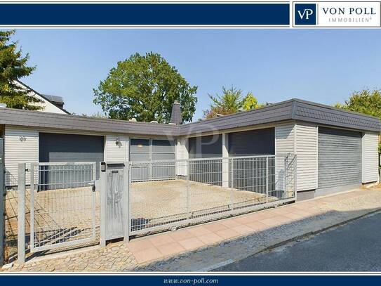 Modernisierter Bungalow mit Gartenbrunnen, 3 Garagen und Photovoltaikanlage