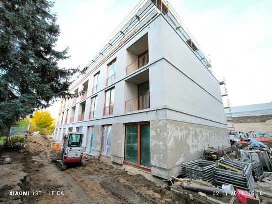 Prämierte Architektur: Gartenhauswohnung mit kleinen Garten+Terrasse und großem Wohn- Eßbereich