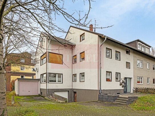 Dreifamilienhaus mit Garten und zwei Garagen in Bonn-Beuel zum Verkauf