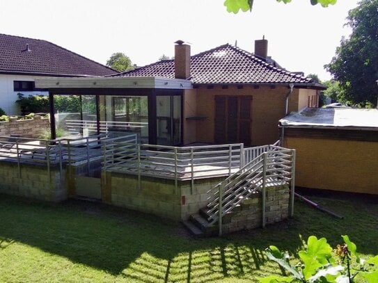 Direkt einziehen und wohlfühlen! Modernisierter Bungalow mit beheiztem Wintergarten und Vollkeller