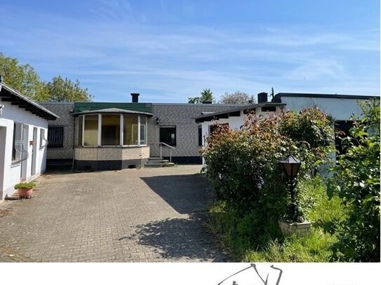 Ideal für Handwerker! Freistehender Bungalow mit kl. Bachlauf auf großzügigem Grundstück in GV-Wevelinghoven