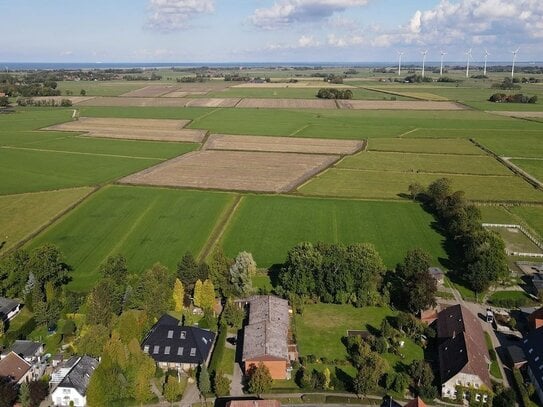 Nordsee-Idylle in Tossens - sehr umfangreich saniertes Reihenendhaus mit Balkon und Garten!