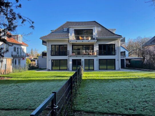 Wunderschöne Gartenwohnung mit eleganter Dreifamilienvilla.