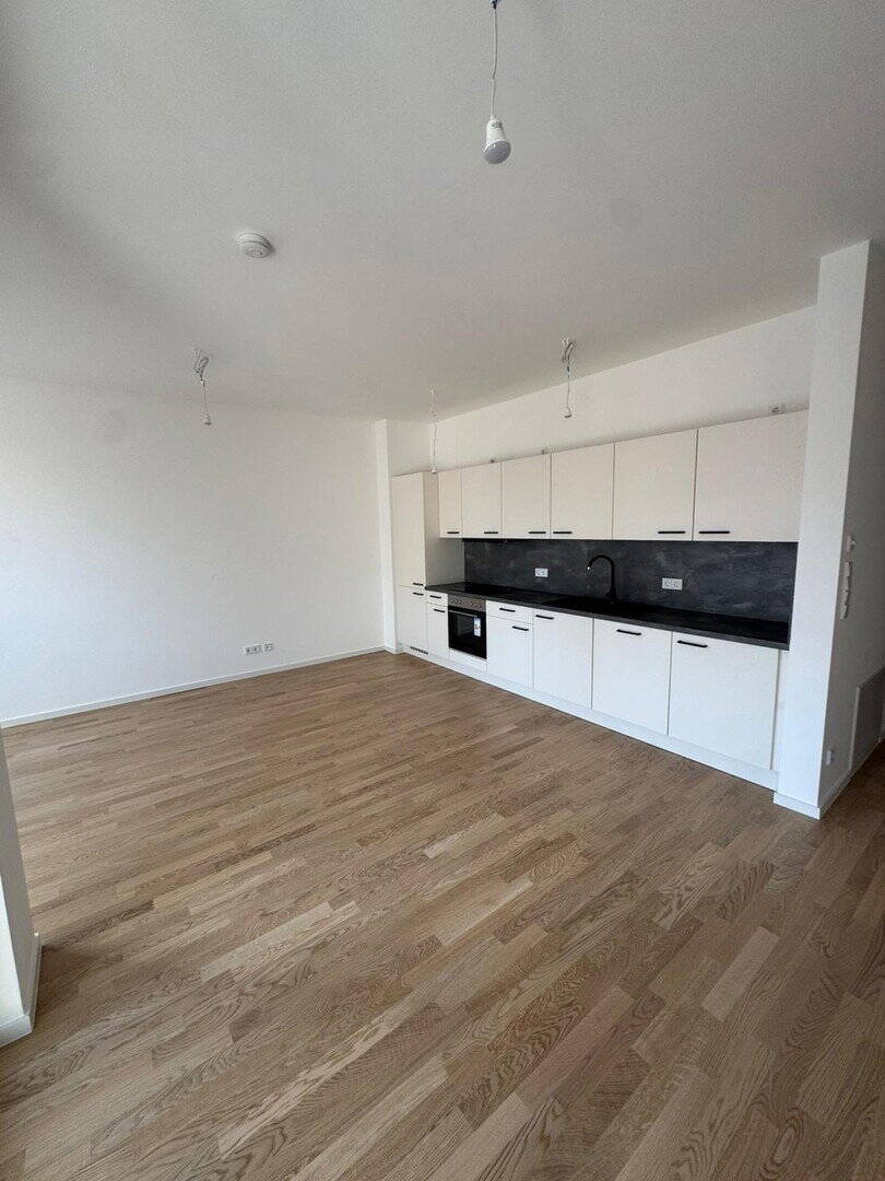 Direkt am Wasser ¬| Neubau + Erstbezug | ~67qm 2 Zi. | Loggia, Fahrstuhl, Einbauküche, Stellplatz - Photo 1