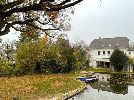 WOHN- UND GESCHÄFTSHAUS MIT BAULAND IN BESTLAGE