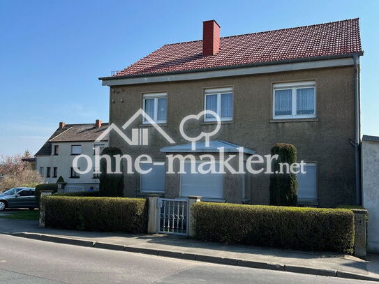 Ein- bis Zweifamilienhaus mit großem Garten, Gewerbeflächen, Doppelzufahrt & Garagen